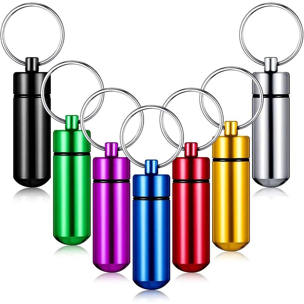 Aluminum Keychain Pill Case Portable Waterproof Mini Bottle in various colors including black, green, purple, blue, red, yellow, and silver, each featuring a key ring attachment.