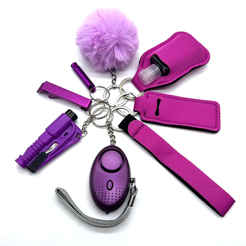 Purple outdoor self-defense keychain accessories set for women, featuring various attachments including pom-pom, whistle, pepper spray, seat belt cutter, and alarm. Loving EasyLife, Safety Keychain, AVADA - Best Sellers.